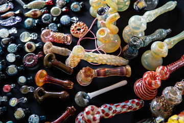 Design accessories for smoking marijuana on the black background