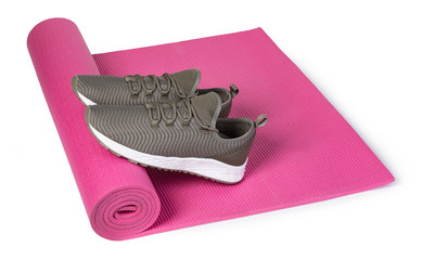 Sport shoes and yoga mat