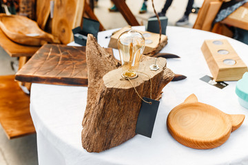 wooden objects for sale on an outdoor flea market table