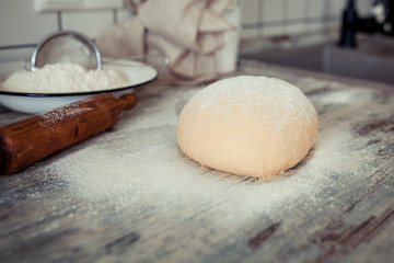 Baking ingredients placed on wooden table, ready for cooking. Concept of food preparation, Making bread at home, kitchen on background.