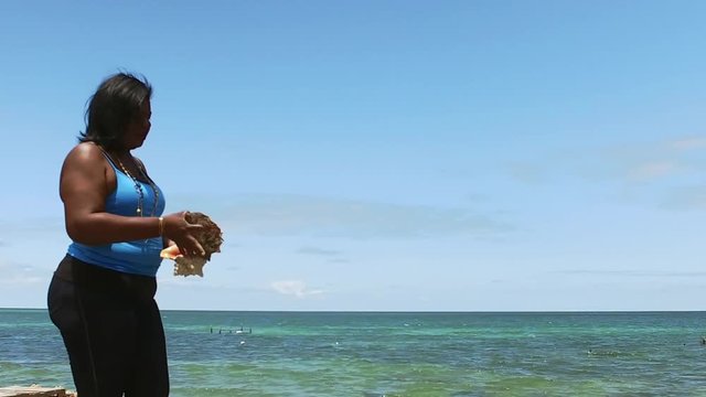 The Original Bahama Mama Holding Conch Shell, Conch Shell Palace,  West End Grand Bahama, Bahamas