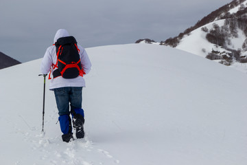 Fototapeta na wymiar hiker on mountain and snow