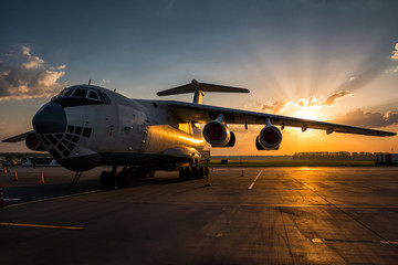 Fototapeta na wymiar Wide body transport cargo airplane at airport apron in the morning sun