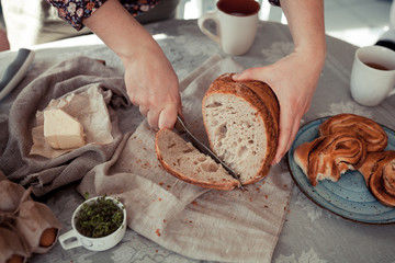 Baking ingredients placed on wooden table, ready for cooking. Concept of food preparation, Making bread at home, kitchen on background.