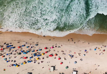 Crowded summer beach, people, umbrellas. top view