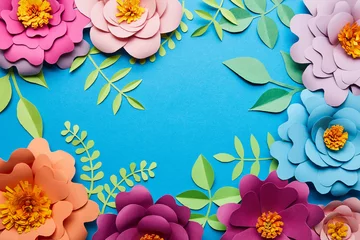 Fototapeten top view of multicolored paper cut flowers with leaves on blue background with copy space © LIGHTFIELD STUDIOS