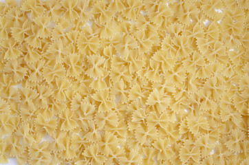 Italian uncooked pasta. Raw farfalle. Healthy food. Italian dishes.