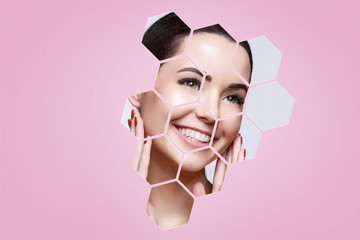 Portrait of model with natural nude make up touching her face in pink hexagon frames. Beautiful...