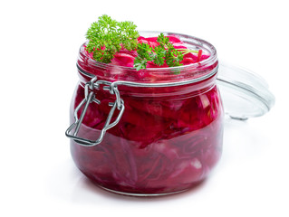 Salad with cabbage and beetroot in glass jar isolated on white