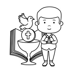 little boy with bible and chalice first communion