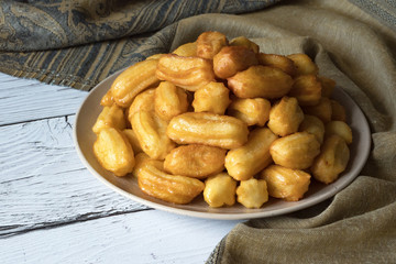 tulumba- arabian syrup-soaked fried sponge honey 