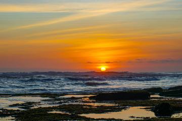 Obraz premium Sunset view from beach near Tanah Lot Temple in Bali Indonesia