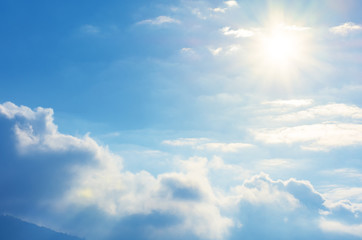 Fototapeta premium blue sky with sun and clouds. beautiful bright nature scenery