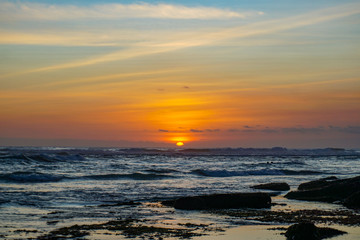 Sunset view from beach near Tanah Lot Temple in Bali Indonesia