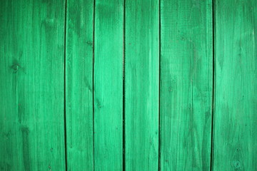 Naklejka premium Green wooden wall - vertical painted wood texture for background