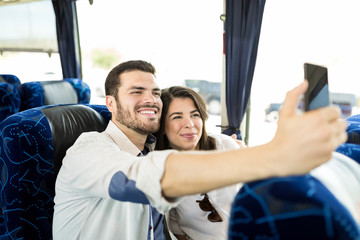Fototapeta na wymiar Couple Making Memories During Bus Travel