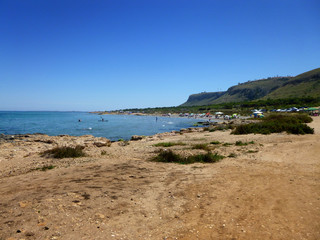 panoramic view of a beach with people enjoying the summer