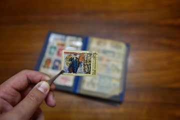 Old postage stamp on the table