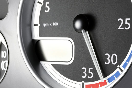 tachometer of a truck in red sphere