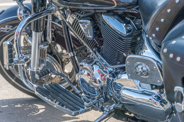 Close up view of a shiny motorcycle engine. Chrome motorcycle engine close up