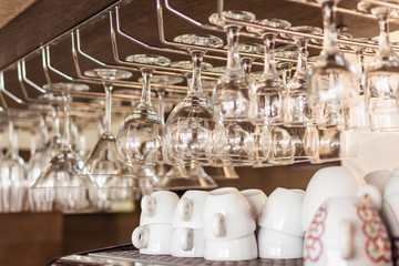 Espresso cups and drinking glasses. Interior of a restaurant