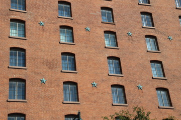 Fototapeta na wymiar Star decoration of the brown brick wall 
