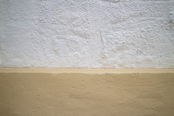 White and yellow concrete wall
