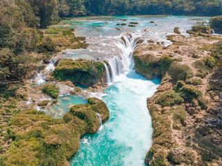 Naklejka na ściany i meble Aerial view of the turquoise waterfalls at Las Nubes in Chiapas, Mexico