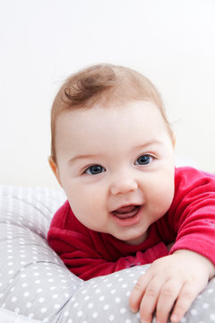 Portrait Of A Happy Baby With A Toothless Smile