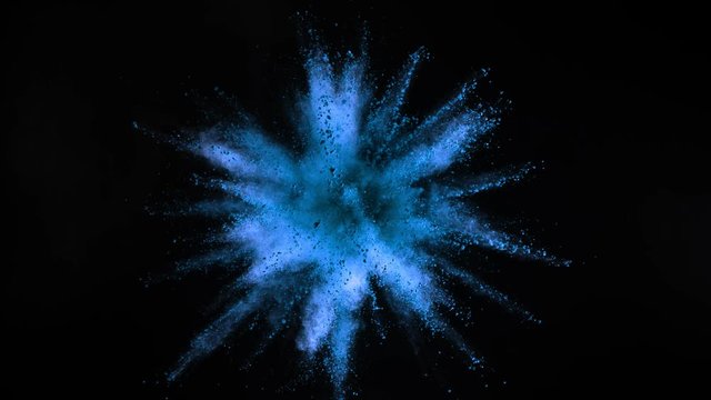 Super slow motion of coloured powder collision isolated on black background. Filmed on high speed cinema camera, 1000fps.