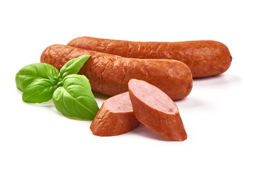 German traditional smoked sausages with basil leaves, dry meat, close-up, isolated on white background