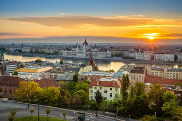 Budapest, Hungary - Aerial panoramic view of Budapest at sunrise with sunlight, residential buildings of Buda side and Parliament of Hungary