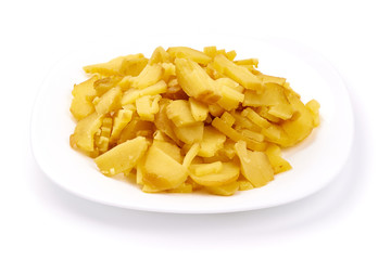 Sliced boiled potatoes in plate, ingredients for salad, close-up, isolated on white background