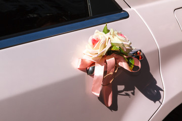 decor of two roses on a white car door