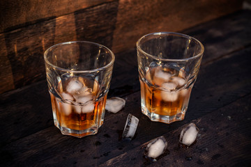 Whiskey in glass with ice