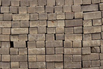 Bricks stones paving stones texture background, stack a pile of paving stones close-up