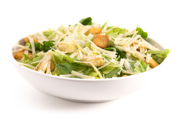Bowl of Fresh Caesar Salad Isolated on a White Background - obrazy, fototapety, plakaty