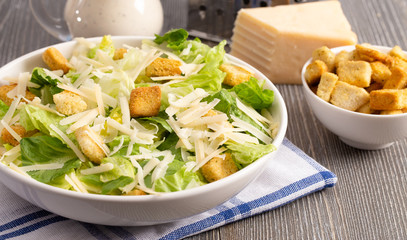 Fresh Caesar Salad on a Wooden Table