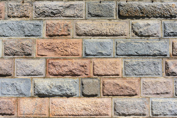 Wall of decorative stone. Masonry. The texture and design of the stone wall.