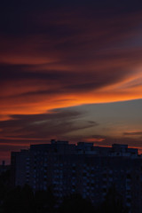 Dark colored clouds in sky sunset with orange