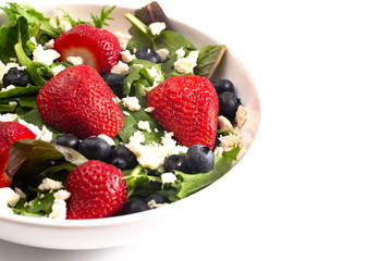 ABright Garden Salad with Fresh Fruit Isolated on a White Background