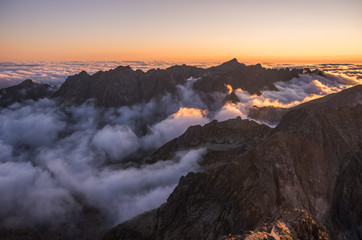 Fototapeta premium Mountains Landscape with Inversion in the Valley at Sunset as seen From Rysy Peak in High Tatras, Slovakia