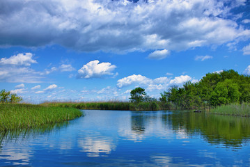 The beautiful Tisza lake with a nice cloudscape and a nice reflection on the water