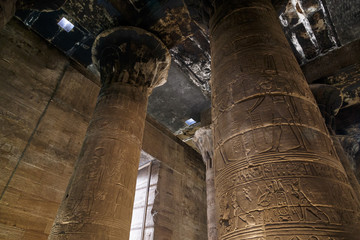 Columns with hieroglyphs inside of The Temple of Horus at Edfu, Egypt. The temple complex of Horus...