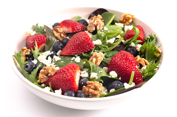 Bright Garden Salad with Fresh Fruit Isolated on a White Background