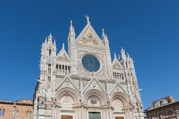 Fototapeta na wymiar The West Façade of the Cathedral of Siena (Duomo di Siena)