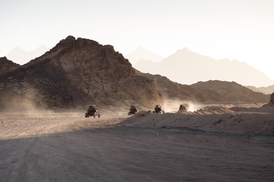 Extreme buggy races at sunset near the mountains and a Bedouin village in the desert near Hurghada. Egypt
