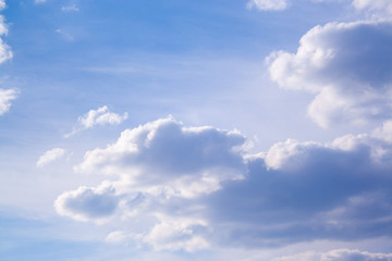 White clouds high in the sky at windy winter day background