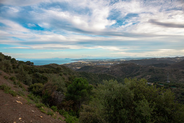 Fototapeta na wymiar Landscape. View of the mountains and the sea from the observation deck of the city of Estepona.