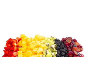 Lines of Rainbow Colored Fruit Isolated on White Background